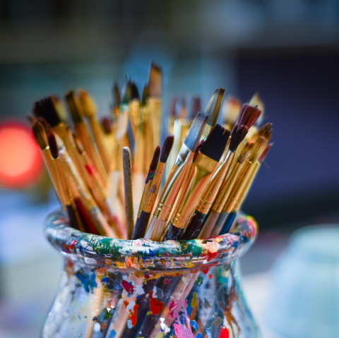 Paint brushes in a jar