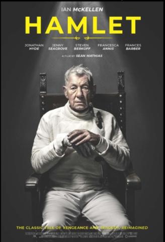 Hamlet, played by Ian McKellen is sitting in a chair, wearing all white fencing breeches. The room is dark, with the only light shining on him. 